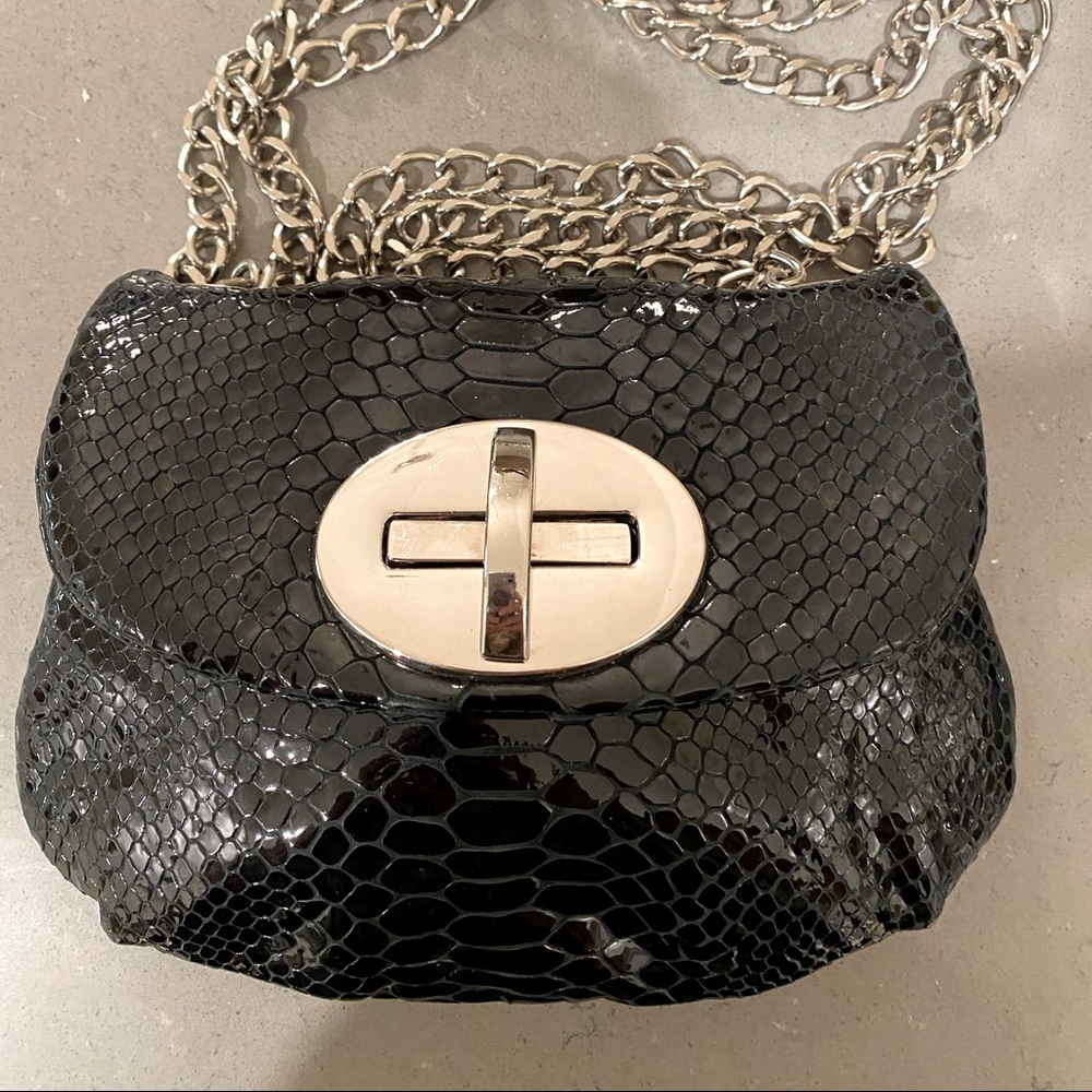 Stuart Weismann black crossbody small bag with silver hardware with chain strap